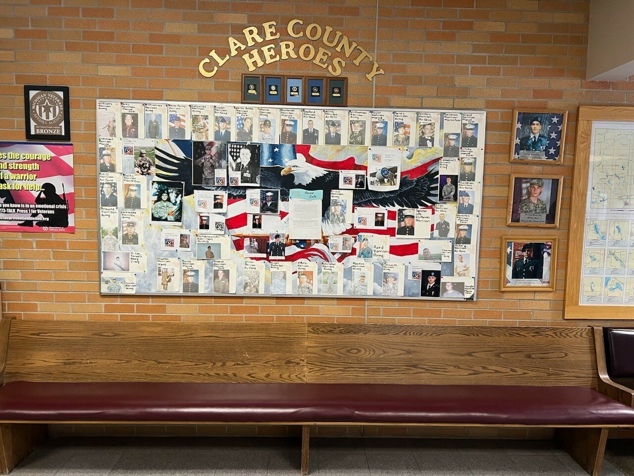 Several of the components of the original Honor Wall, shown here, were relocated to create space for the new photo installations, In Memoriam and POW/MIA Table.